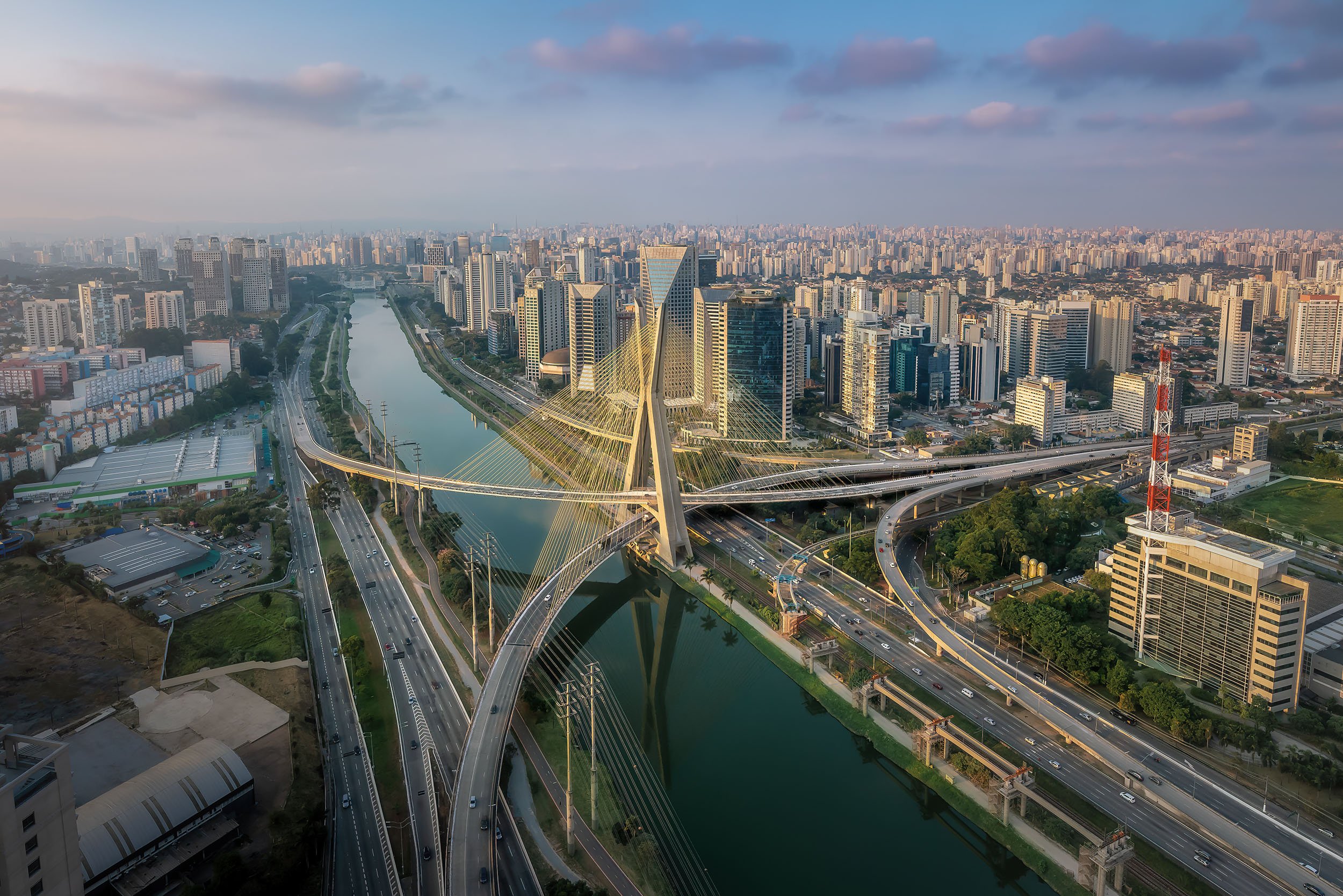 Aerial view of Octavio Frias de Oliveira Bridge (Ponte Estaiada) over Pinheiros River at sunset – Sao Paulo, Brazil